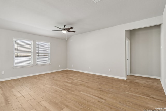 empty room with ceiling fan and light wood-type flooring