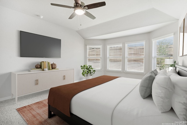 bedroom with carpet, vaulted ceiling, and ceiling fan