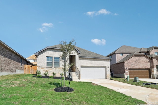 view of front of home with a front lawn and a garage