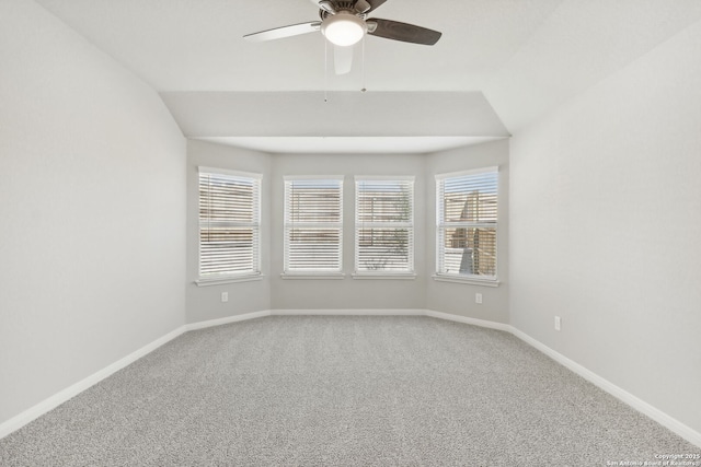 unfurnished room featuring carpet, ceiling fan, and lofted ceiling