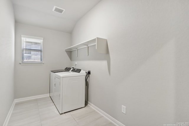 laundry area featuring separate washer and dryer