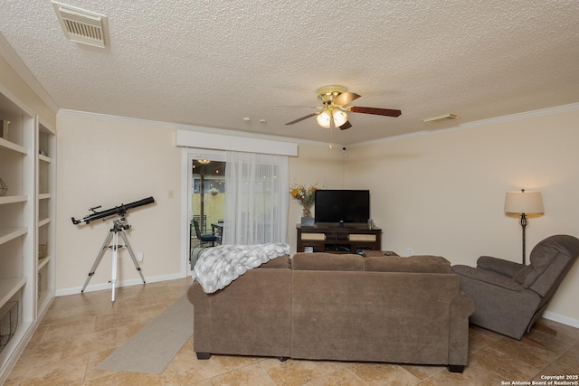 living room with ceiling fan, ornamental molding, a textured ceiling, and built in shelves