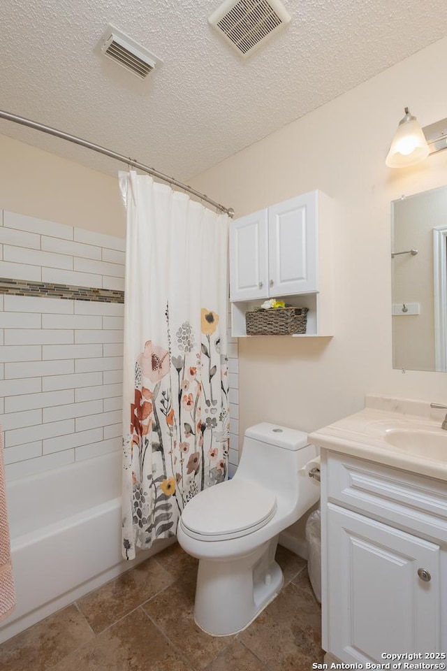 full bathroom with vanity, toilet, a textured ceiling, and shower / tub combo