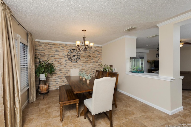 dining room with ceiling fan with notable chandelier, a textured ceiling, and ornamental molding