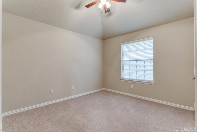 unfurnished room with ceiling fan, light colored carpet, and lofted ceiling