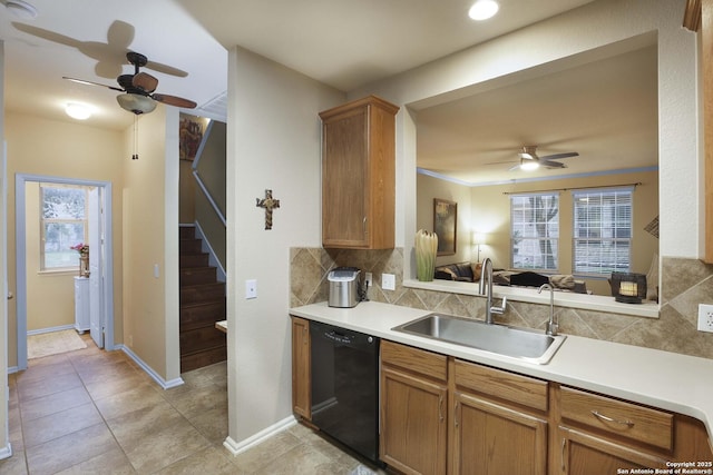 kitchen featuring ceiling fan, sink, black dishwasher, tasteful backsplash, and crown molding