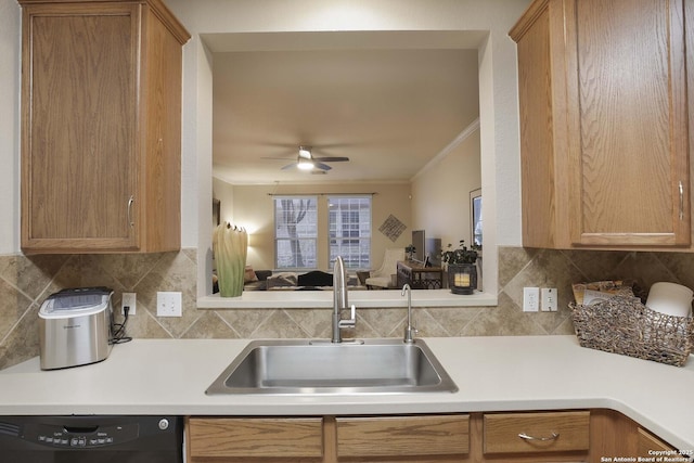 kitchen with ceiling fan, sink, black dishwasher, decorative backsplash, and ornamental molding