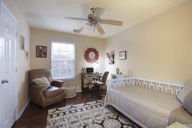 bedroom featuring ceiling fan and dark hardwood / wood-style floors