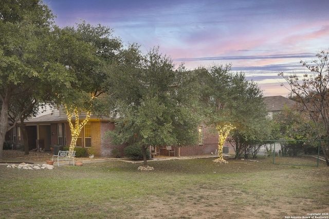 view of yard at dusk