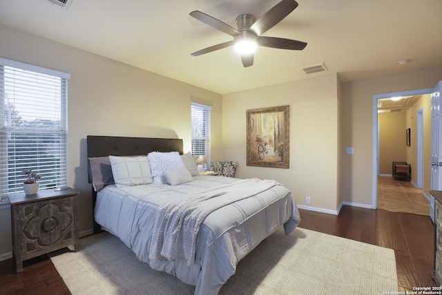 bedroom featuring ceiling fan and dark hardwood / wood-style floors