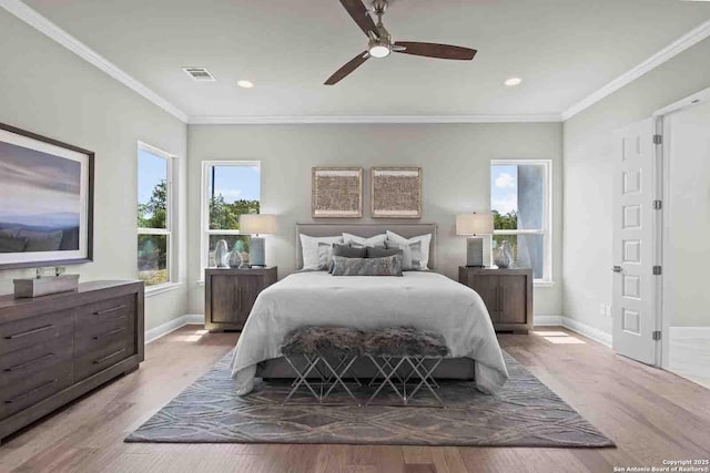 bedroom with ceiling fan, ornamental molding, and light hardwood / wood-style flooring