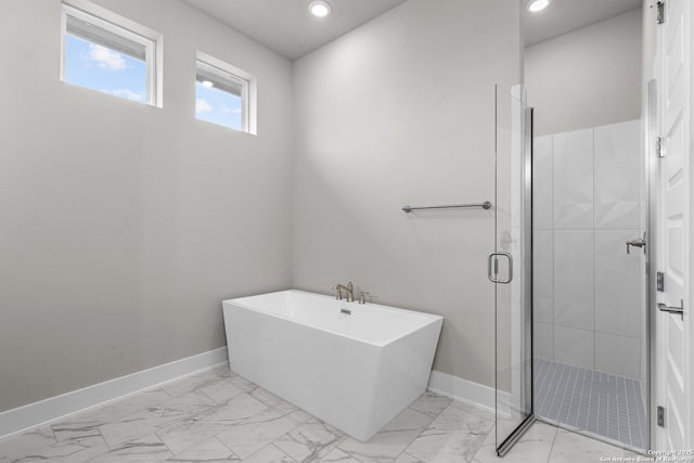 bathroom with shower with separate bathtub