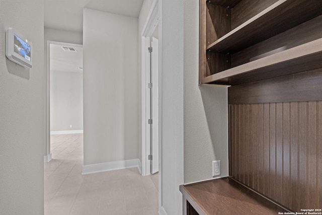 mudroom with light tile patterned floors