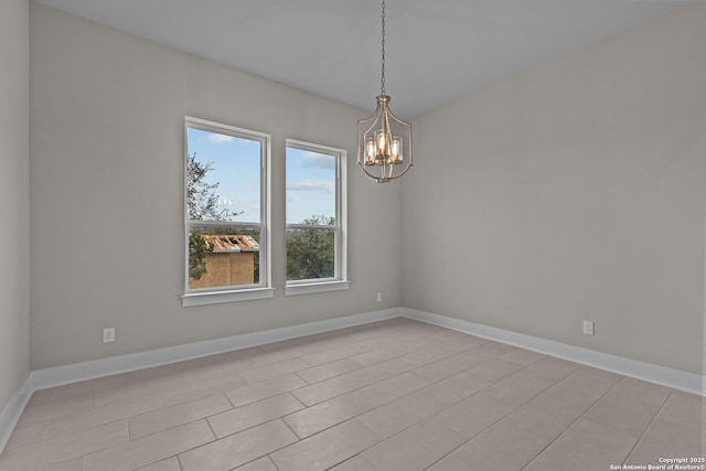 empty room with a notable chandelier