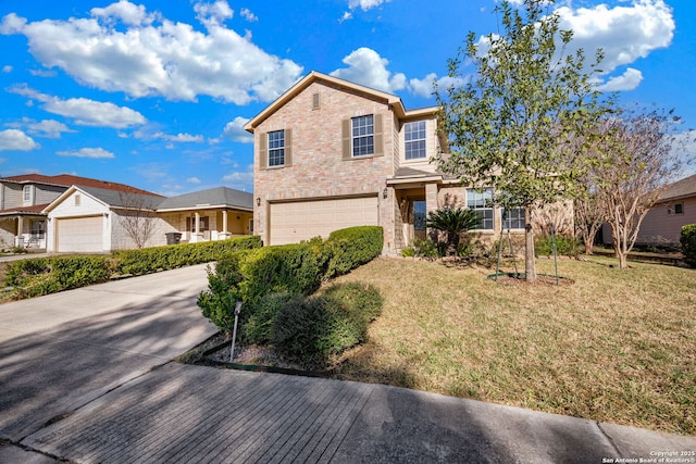 view of front property featuring a front yard and a garage