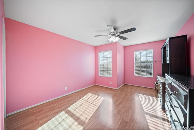 interior space with ceiling fan and light wood-type flooring