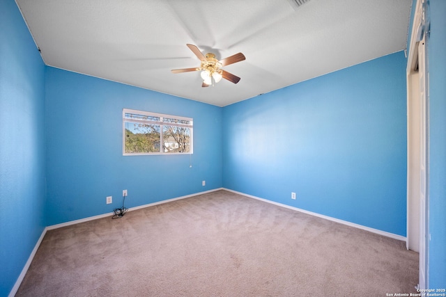 carpeted empty room with ceiling fan