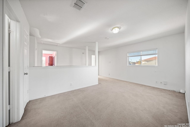 empty room featuring light colored carpet