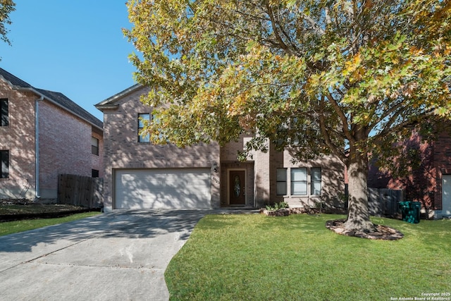 view of front of house with a front yard and a garage