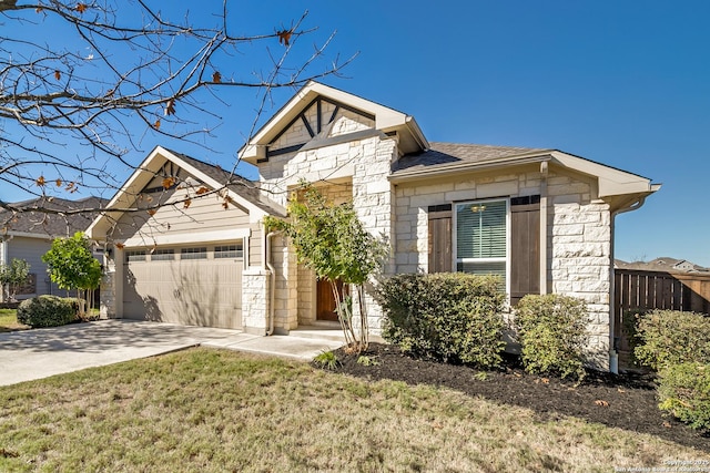 view of front of home with a garage and a front yard