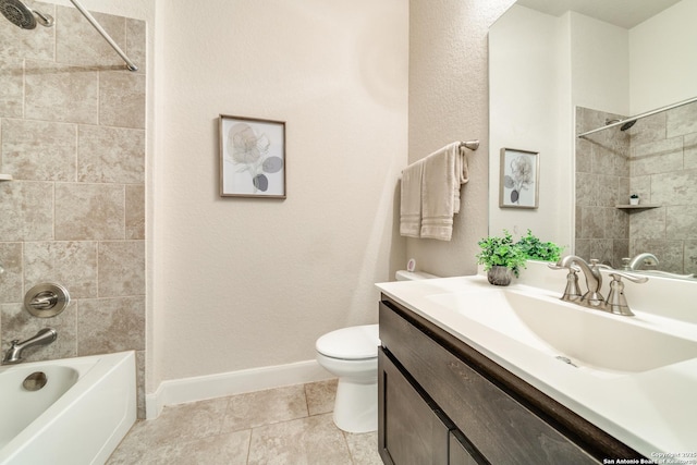 full bathroom with tile patterned floors, toilet, vanity, and tiled shower / bath