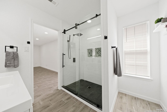 bathroom with a shower with shower door