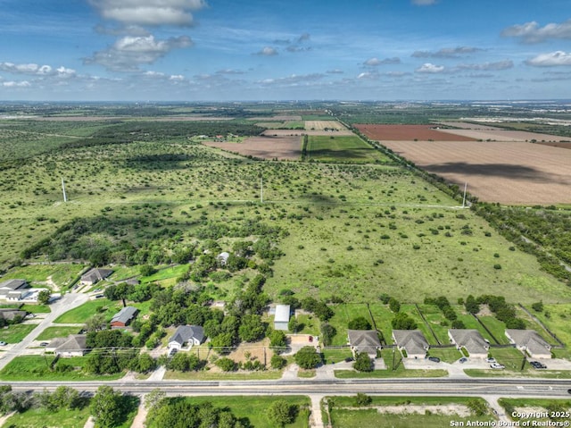 birds eye view of property featuring a rural view