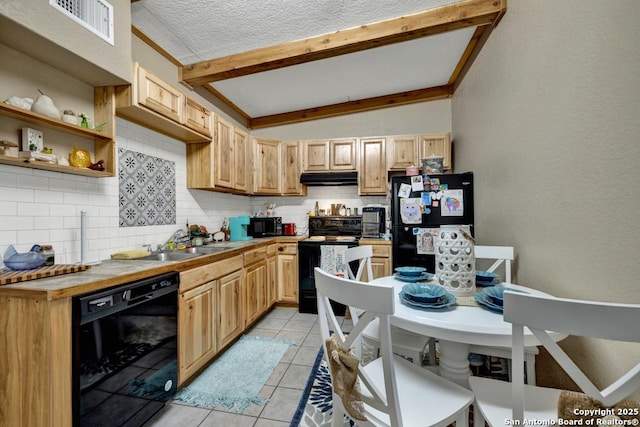 kitchen featuring tasteful backsplash, light brown cabinetry, black appliances, and sink