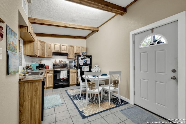 kitchen with black appliances, light tile patterned floors, light brown cabinetry, and tasteful backsplash