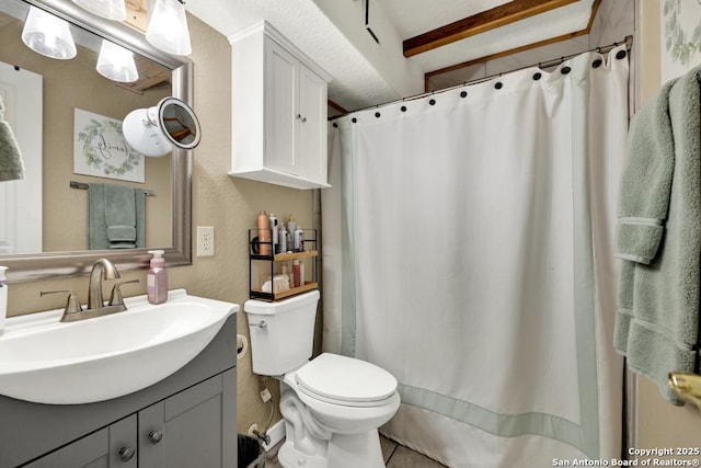 bathroom with walk in shower, beamed ceiling, vanity, and toilet