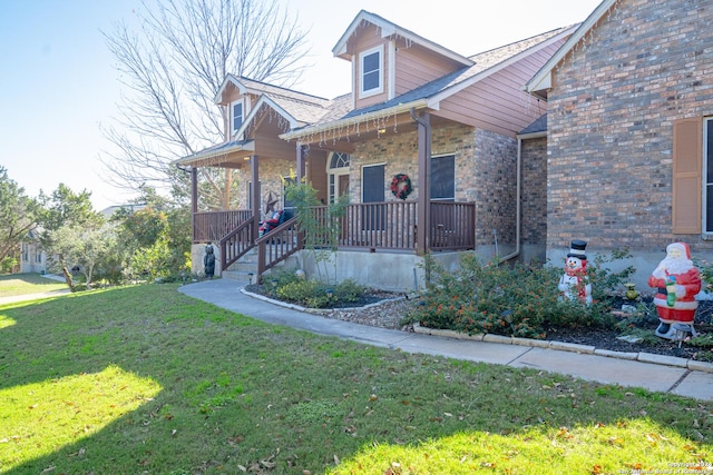 view of front of home featuring covered porch and a front lawn