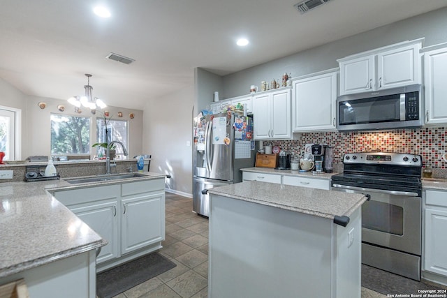 kitchen with white cabinetry, sink, a chandelier, and appliances with stainless steel finishes