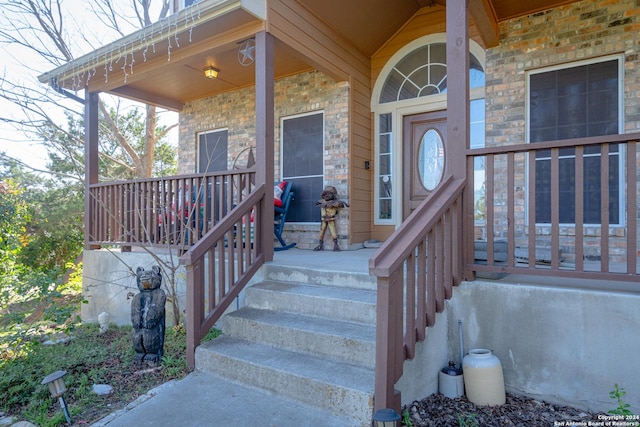 doorway to property with a porch