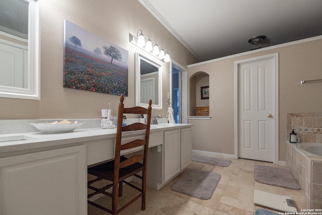 bathroom with vanity, tiled bath, and ornamental molding