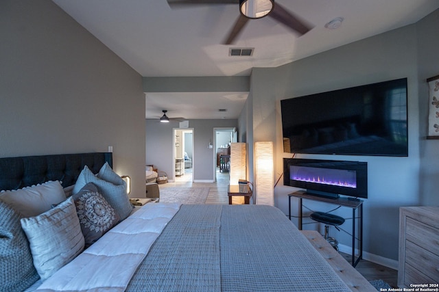 bedroom featuring ceiling fan and light hardwood / wood-style floors