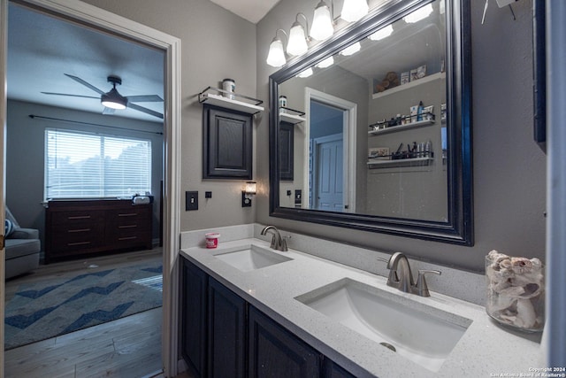 bathroom with ceiling fan, hardwood / wood-style floors, and vanity