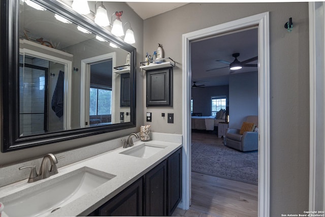 bathroom with hardwood / wood-style flooring, vanity, and ceiling fan