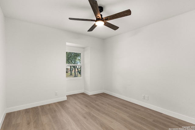 unfurnished room featuring light hardwood / wood-style flooring and ceiling fan