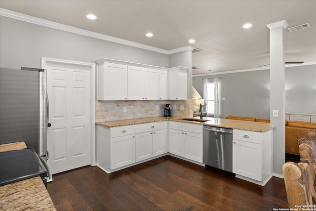 kitchen with white cabinets, appliances with stainless steel finishes, dark wood-type flooring, and sink