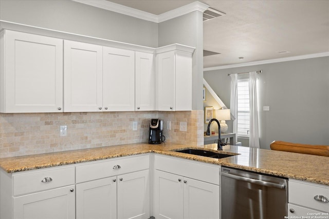 kitchen featuring dishwasher, backsplash, white cabinets, and sink