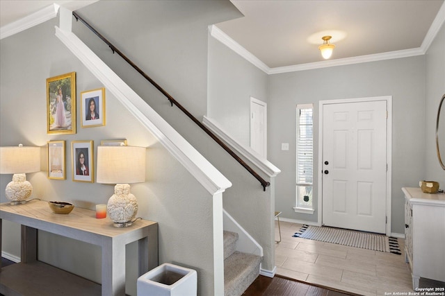 foyer entrance featuring ornamental molding