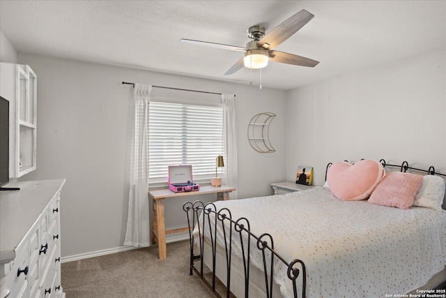 bedroom featuring light carpet and ceiling fan