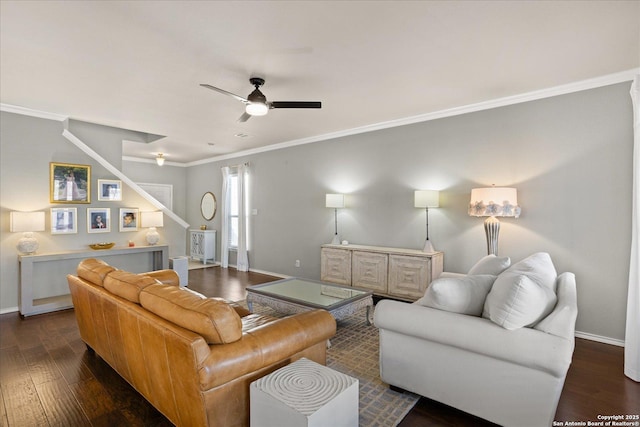 living room featuring dark hardwood / wood-style flooring, ceiling fan, and crown molding