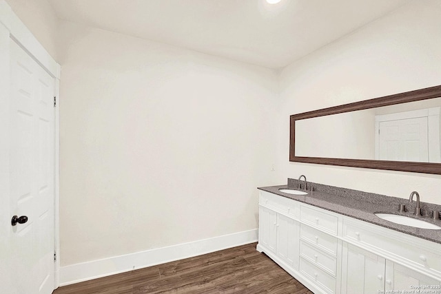 bathroom with vanity and hardwood / wood-style flooring