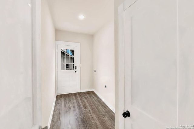 laundry area featuring hookup for an electric dryer and hardwood / wood-style flooring