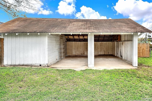 view of outdoor structure with a lawn