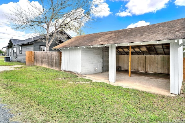 exterior space with a yard and central AC unit