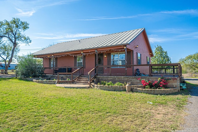 view of front of home with a porch and a front lawn