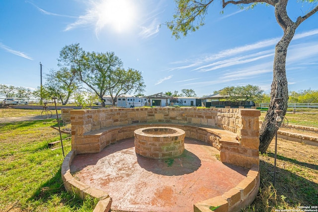 view of patio / terrace with an outdoor fire pit