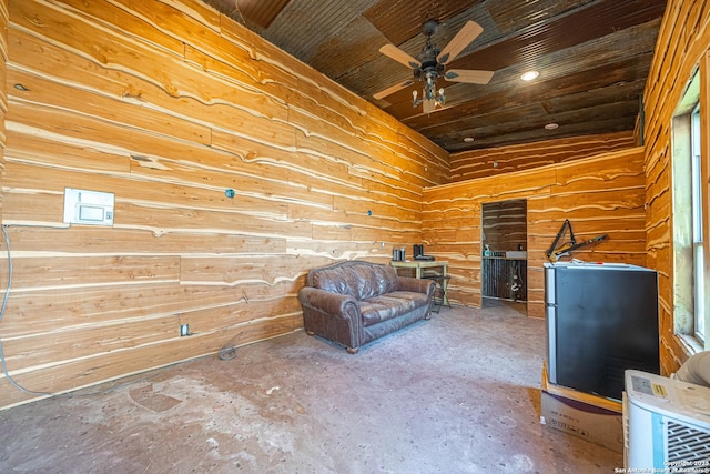 unfurnished room with ceiling fan and wooden ceiling